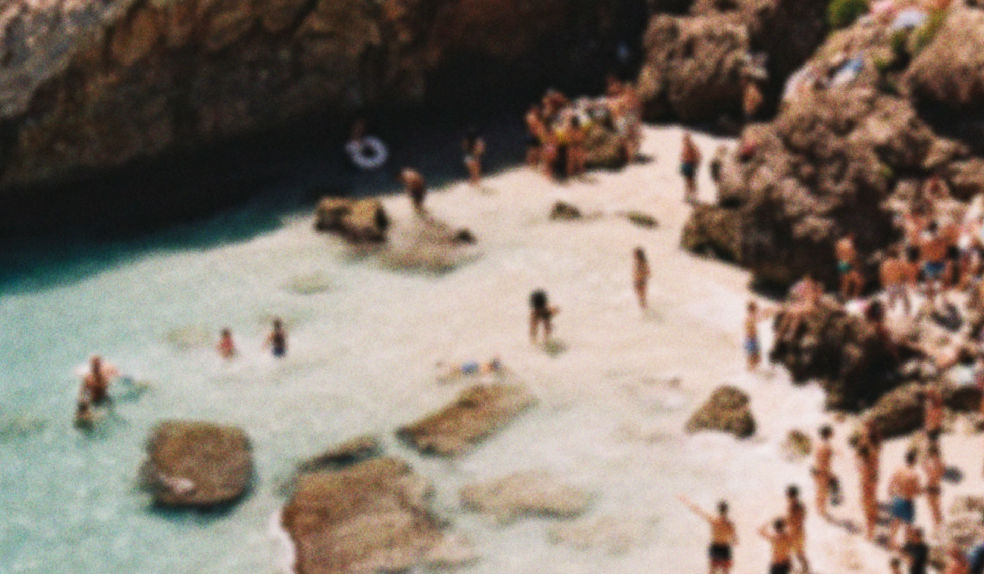 Image of ocean shore with crowd.
